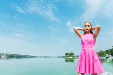 beautiful girl posing on a sky background