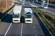 © JarekKilian - Road transport - two lorries driving side to side on the motorway junction