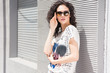 © romanets_v - Beautiful young woman walking on the street
