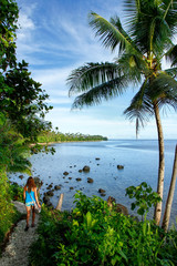 Wall Mural - Young woman hiking Lavena Costal Walk on Taveuni Island, Fiji