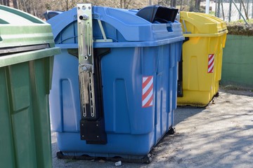 Wall Mural - yellow, blue and green street garbage containers