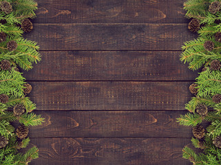 Wall Mural - Frame from decorated Christmas tree on rustic wooden background