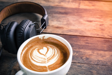 Wall Mural - latte coffee cup and headphone on table