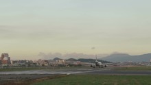  Airplane Taxxiing Down Runway At Taipei Songshan Airport