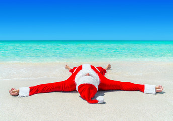 Poster - Santa Claus enjoy sunbathing at tropical ocean beach in turquoise waves, Christmas and New Year vacation destinations in hot countries concept