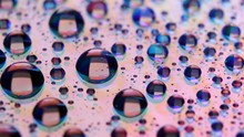Abstract Background With Shiny Water Drops, Rain On The Glass.