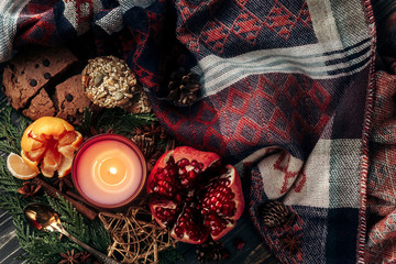 stylish christmas flat lay with candle and presents with red rib