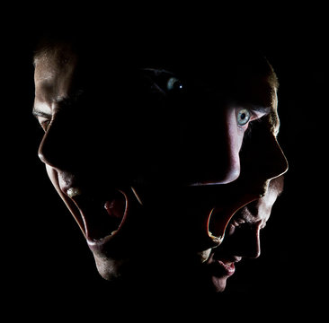 Fototapete - Dark portrait of a man with green eyes concept anger agony disheartened force