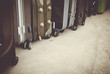 Vintage style of travel bags or luggage on cement floor. Luggage bags bag travel tourism stacked together on the floor.