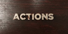 Actions - Grungy Wooden Headline On Maple  - 3D Rendered Royalty Free Stock Image. This Image Can Be Used For An Online Website Banner Ad Or A Print Postcard.