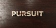 Pursuit - grungy wooden headline on Maple  - 3D rendered royalty free stock image. This image can be used for an online website banner ad or a print postcard.