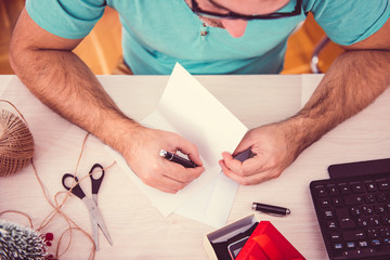 Man writing a christmas card