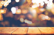 Empty of wood  table top with  blurred light gold bokeh abstract