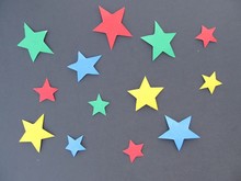 
A Set Of Colored Stars On A Black Background For A Holiday