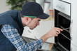 © auremar - checking a broken oven