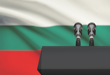 Pulpit and two microphones with a national flag on background - Bulgaria