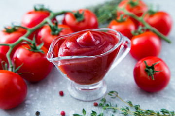 Wall Mural - Tomato ketchup sauce with garlic, spices and herbs with cherry t
