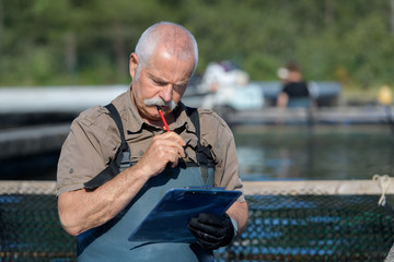 fisherman with clipboard counting