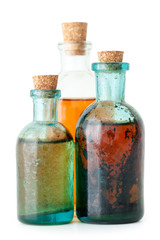 Wall Mural - Three bottles of herbal infusion or essential oil closeup 