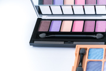 Make up set and brushes, Glossy make-up powder background. Makeup palette
Beautiful makeup background. Makeup brush on colorful makeup palette with copy space.

