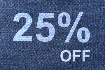 jeans on sale with 25 percent of price tag on the fabric texture