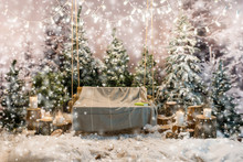 Wooden Swing With A Blanket In A Snow-covered Park Or A Forest,