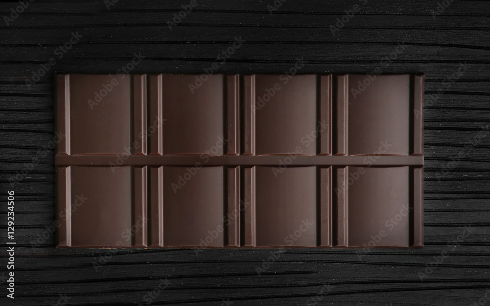 Chocolate bar on wooden background