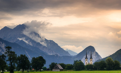 Wall Mural - tramonto in montagna con chiesa