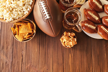 Wall Mural - Table full of tasty snacks and beer prepared for watching rugby on TV