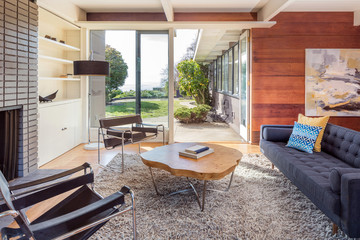 Elegant wooden designer interior with french doors and fire place.