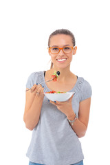 Wall Mural - Beautiful girl eating healthy food, isolated on white background