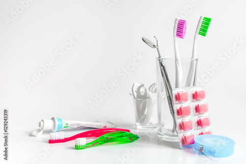 Fotografie, Obraz toothbrushes in glass on white background tools for oral care