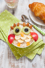 Kids breakfast porridge with fruits and nuts