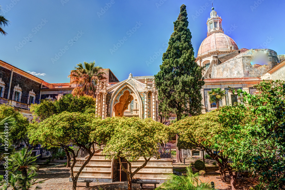 Cloister of the Benedictine Monastery of San Nicolo l'Arena in Catania, Sicily, Italy, - a jewel of the late Sicilian Baroque style. - obrazy, fototapety, plakaty 