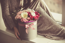 Woman Holding A Flower Bouquet