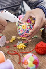 Sticker - man making a handmade christmas ball