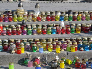 many colored grave lights on the ground ... to always remember