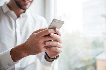 cropped photo of businessman chatting by phone