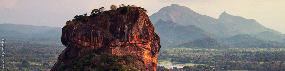 Sunset over the Lion Rock in Sigiriya, Sri Lanka - obrazy, fototapety, plakaty 