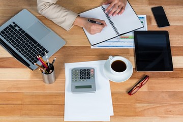 Poster - Businesswoman writing on a diary