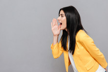 Woman Shouting Over Grey Background