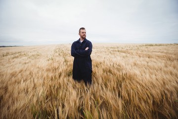Poster - Farmer standing with arms crossed in the field