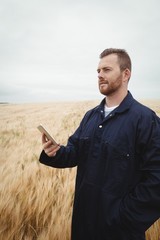 Poster - Farmer using mobile phone in the field