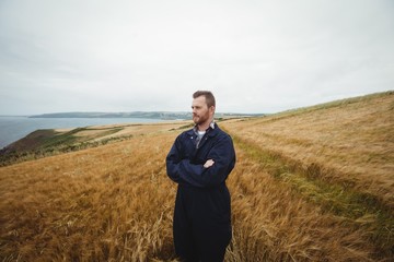 Poster - Farmer standing with arms crossed in the field