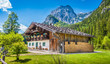 Traditional farmhouse in the Alps in summer