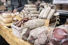 Sausages And Cheese On Display In Italian Food Market
