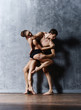 © Acronym - Couple of sporty ballet dancers in art performance.
