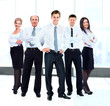 © ASDF - Portrait of businessman leading his team at office