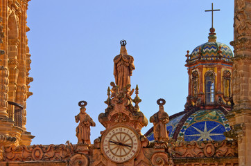 Wall Mural - clock on Santa Prisca church in Taxco, Mexico