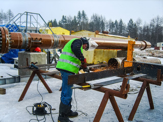 Wall Mural - Safety at work. Welding and grinding of iron constructions. Industrial weekdays welders and fitters